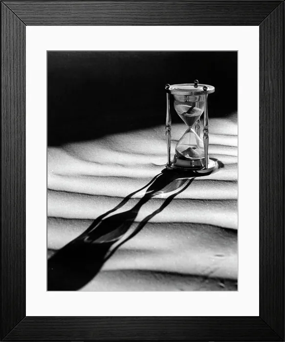 Framed Print : Hourglass with shadow on sand Framed Print : Hourglass with shadow on sand