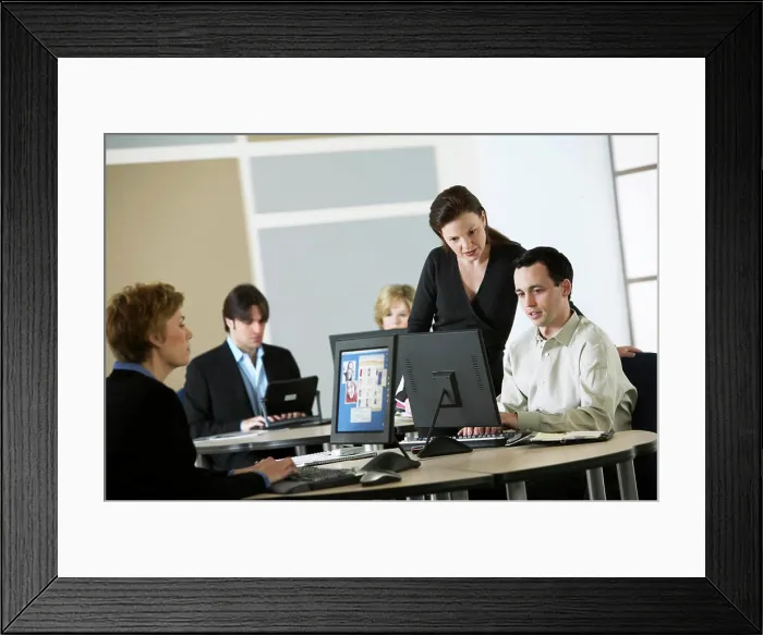 Framed Print : Manager going over business plan with staff Framed Print : Manager going over business plan with staff