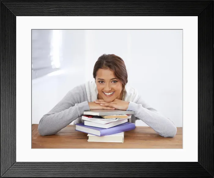 Framed Print : Portrait, books or happy woman learning at table in college Framed Print : Portrait, books or happy woman learning at table in college