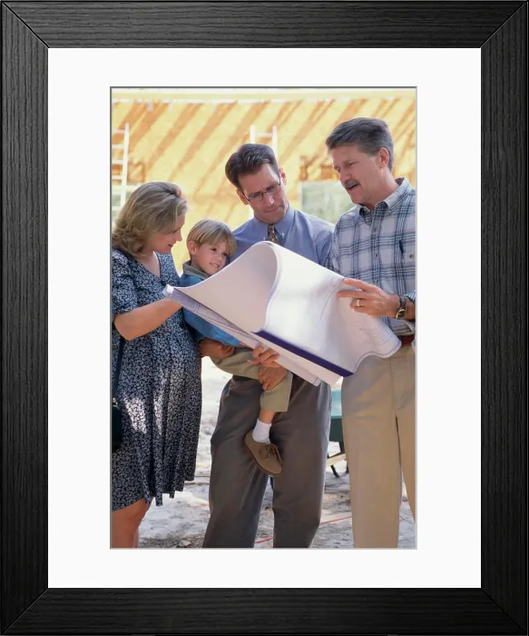 Framed Print : Architect discussing blueprints with a family Framed Print : Architect discussing blueprints with a family