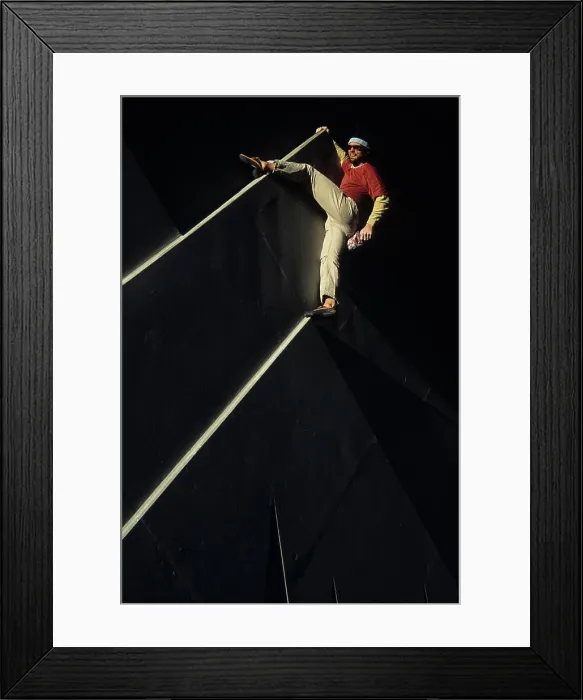 Framed Print : A young man free climbing a sign in Canmore, Alberta, Canada Framed Print : A young man free climbing a sign in Canmore, Alberta, Canada