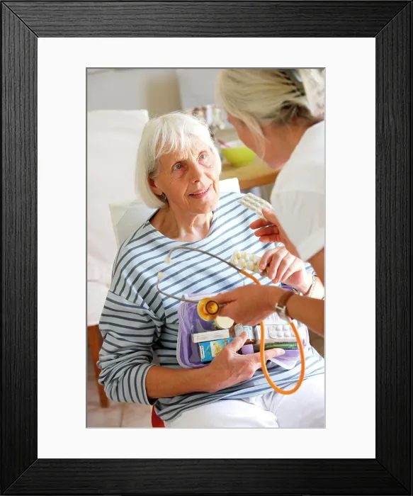 Framed Print : 80 years old woman with general practitioner Framed Print : 80 years old woman with general practitioner