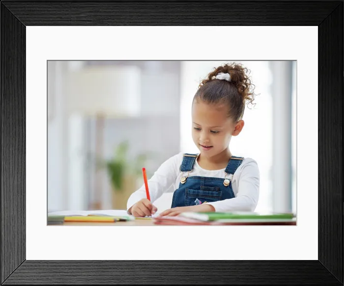 Framed Print : Young girl, writing and homework with book for learning