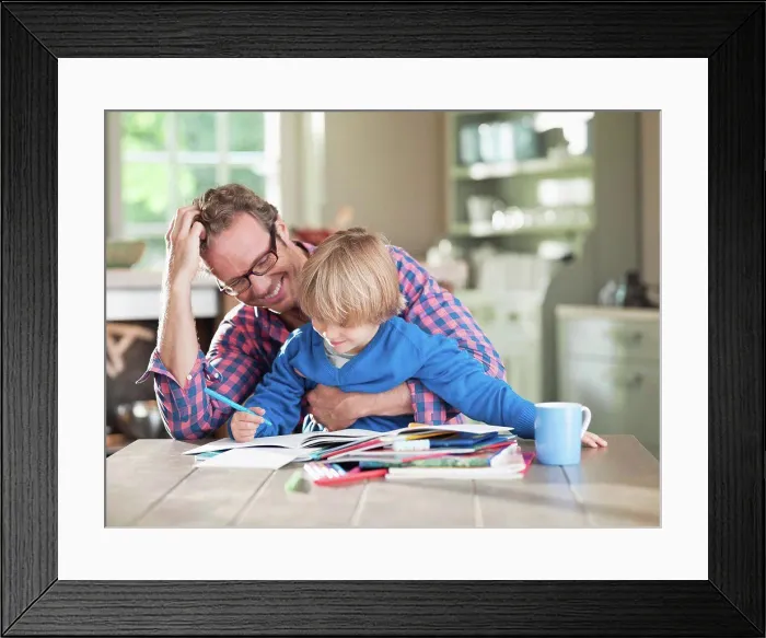 Framed Print : Father and son doing homework at kitchen table, Hamburg, Germany Framed Print : Father and son doing homework at kitchen table, Hamburg, Germany