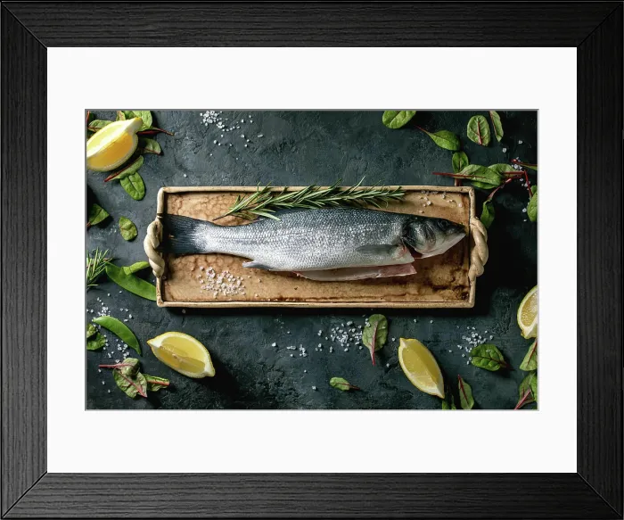 Framed Print : Roher ungekochter Fisch Wolfsbarsch Raw fresh uncooked fish sea bass on ceramit plate ready to cook with lemon