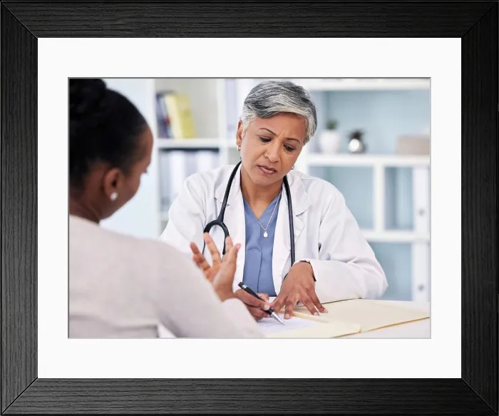 Framed Print : Senior doctor, patient and writing prescription Framed Print : Senior doctor, patient and writing prescription