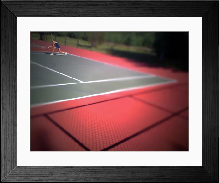 Framed Print : A young girl plays tennis on a bright day Framed Print : A young girl plays tennis on a bright day