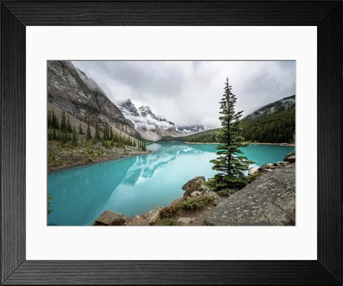 Framed Print : Clouds hanging between mountain peaks