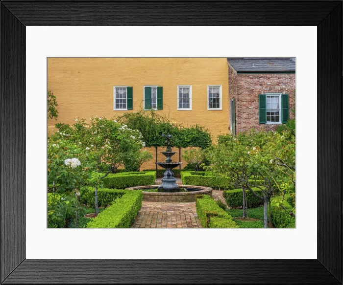 Framed Print : Small tree filled garden in French Quarter of New Orleans Small garden with brick paths