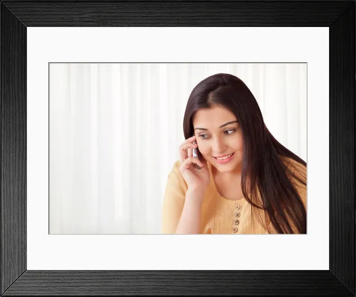 Framed Print : Smiling woman talking on cell phone Framed Print : Smiling woman talking on cell phone