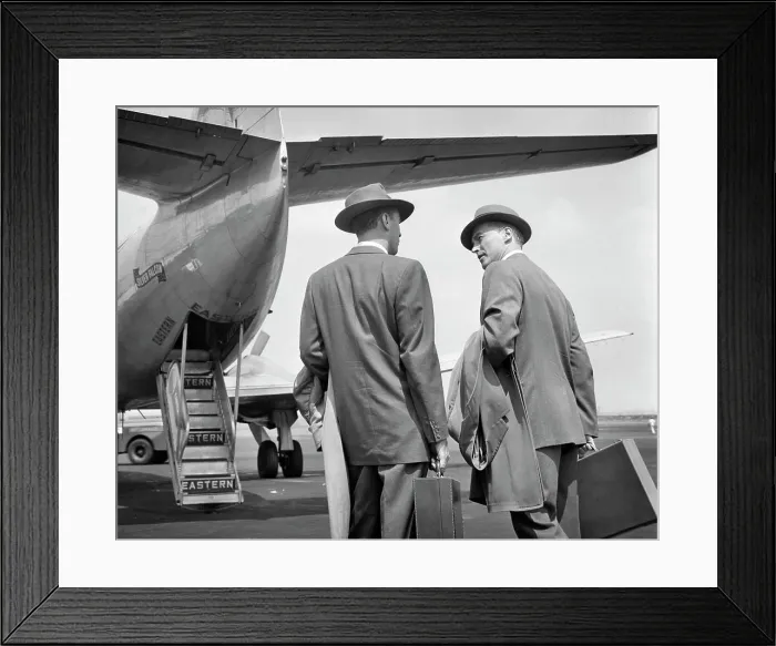 Framed Print : 1950s TWO BUSINESSMEN TALKING ON TARMAC ABOUT TO ENTER REAR DOORS OF EASTERN AIRLINES PASSENGER PLANE Framed Print : 1950s TWO BUSINESSMEN TALKING ON TARMAC ABOUT TO ENTER REAR DOORS OF EASTERN AIRLINES PASSENGER PLANE