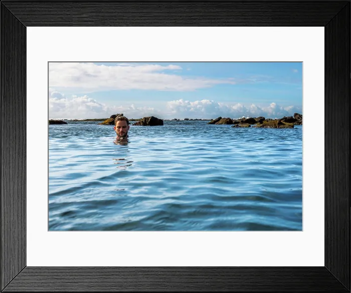 Framed Print : A man relaxing in a tidal pool on the south coast of the Big Island of Hawaii (MR) Framed Print : A man relaxing in a tidal pool on the south coast of the Big Island of Hawaii (MR)