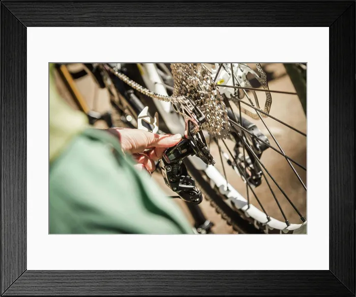 Framed Print : Finetuning a bicycle's gear mechanism Framed Print : Finetuning a bicycle's gear mechanism