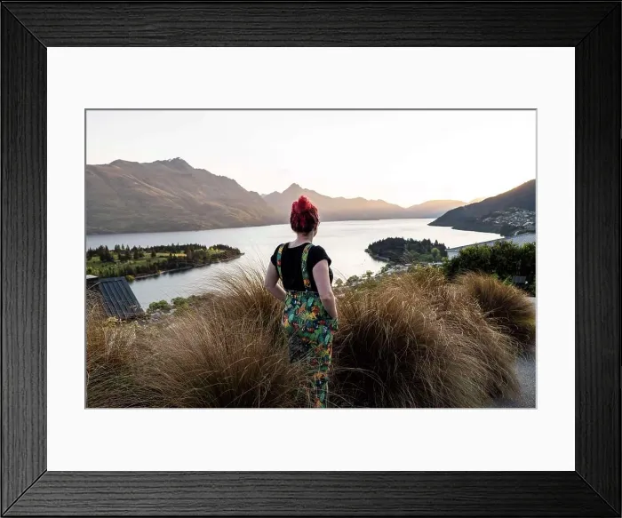 Framed Print : Woman overlooking Queenstown and lake, at sunset in New Zealand