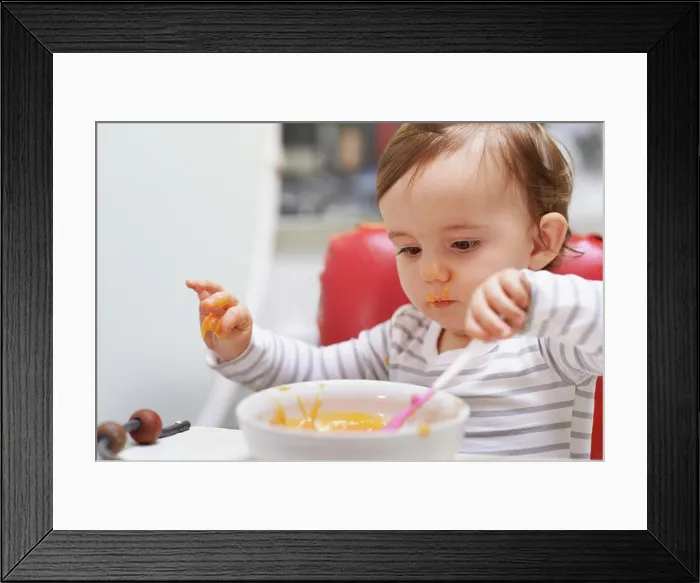 Framed Print : Baby, high chair and playing with bowl for meal Framed Print : Baby, high chair and playing with bowl for meal