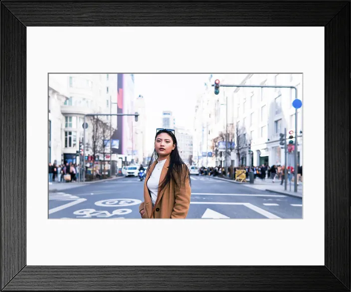 Framed Print : Asian girl crossing the road of Gran Via street in Madrid Framed Print : Asian girl crossing the road of Gran Via street in Madrid
