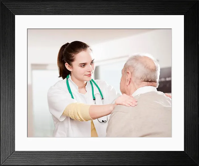Framed Print : Young doctor taking care of an elderly man Framed Print : Young doctor taking care of an elderly man