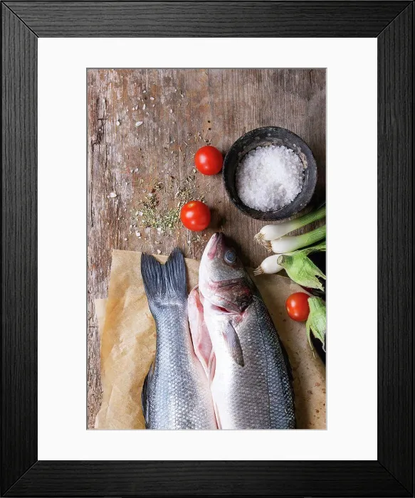 Framed Print : Two raw uncooked seebass fish on baking paper with sea salt