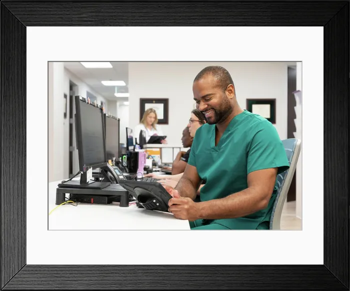 Framed Print : Medical professional using technology for efficient patient care in a modern clinic Framed Print : Medical professional using technology for efficient patient care in a modern clinic