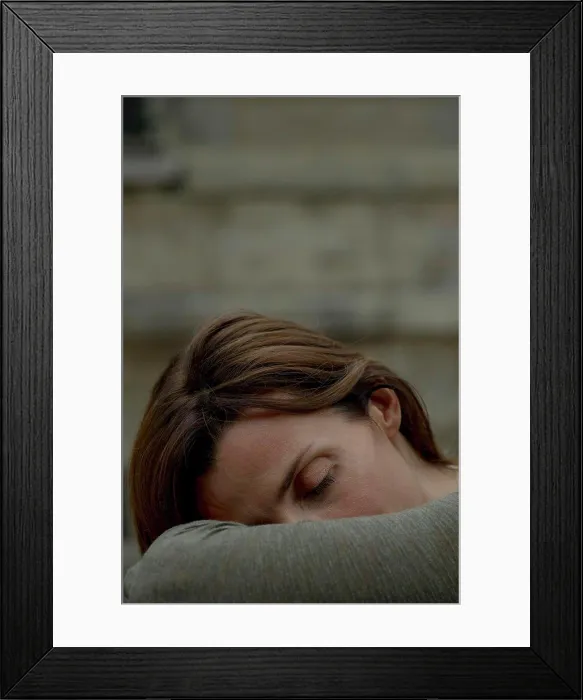 Framed Print : Woman resting head on arms Framed Print : Woman resting head on arms