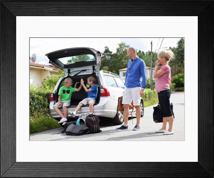 Framed Print : Caucasian couple looking at happy sons sitting in car trunk before going for picnic