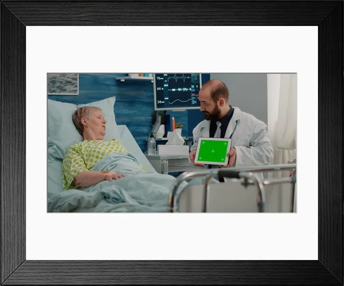 Framed Print : Doctor holding horizontal green screen on digital tablet Framed Print : Doctor holding horizontal green screen on digital tablet