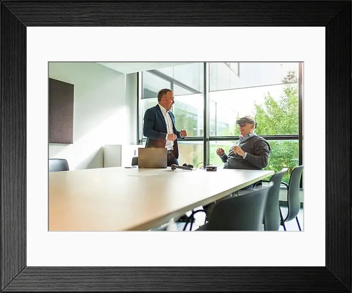 Framed Print : Aged businessmen reflecting the imaginary world with virtual reality in the office Framed Print : Aged businessmen reflecting the imaginary world with virtual reality in the office