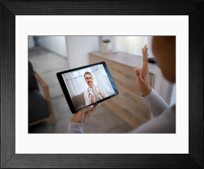 Framed Print : Doctor consulting patient on video call screen for telehealth communication Framed Print : Doctor consulting patient on video call screen for telehealth communication