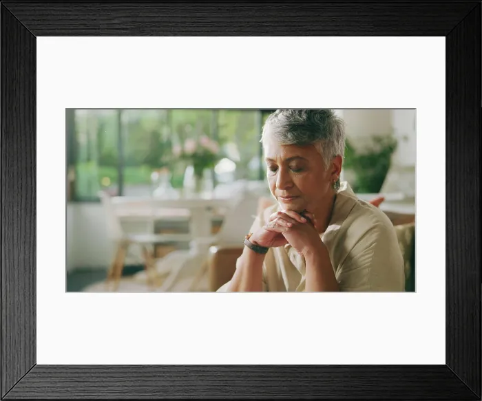 Framed Print : Mature woman, prayer and faith on sofa in home for gratitude