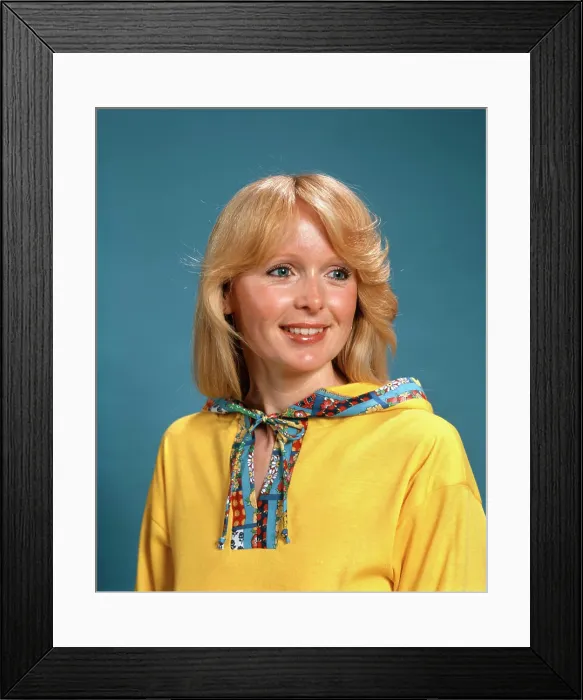 Framed Print : 1970S Portrait Smiling Blond Woman Wearing Yellow Hooded Top With Patterned Trim