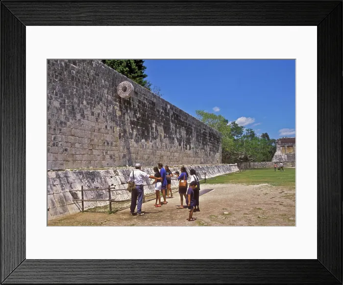 Framed Print : People standing below ancient Mayan Ballgame Hoop in Chichen Itza sport court, Yucatan, Mexico