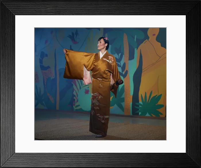 Framed Print : Traditional Japanese dancer in a floral patterned kimono against an artistic backdrop Framed Print : Traditional Japanese dancer in a floral patterned kimono against an artistic backdrop