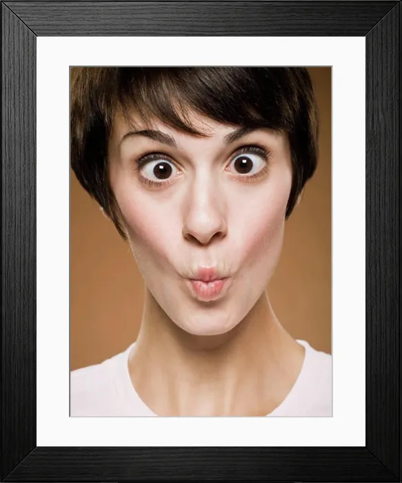 Framed Print : Woman making funny face with eyes crossed and puckered lips Framed Print : Woman making funny face with eyes crossed and puckered lips