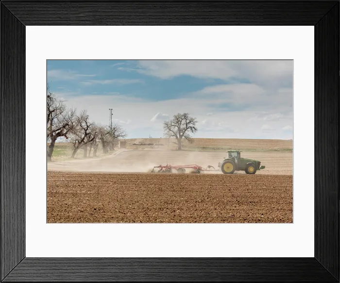 Framed Print : USA, Colorado, Weld County. Tractor tilling a farm field