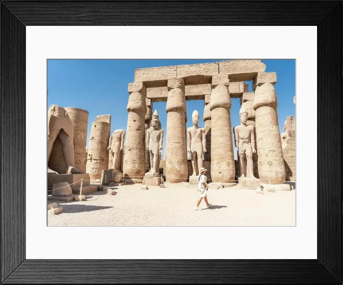 Framed Print : Tourist admiring the ancient temple in Luxor - Egypt Framed Print : Tourist admiring the ancient temple in Luxor - Egypt
