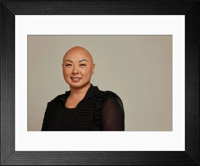 Framed Print : Stylish bald woman with a warm smile Framed Print : Stylish bald woman with a warm smile
