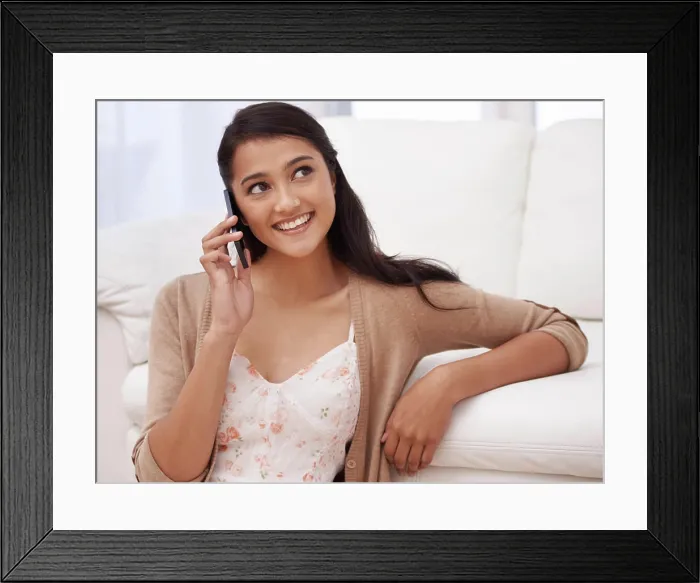 Framed Print : Girl on couch with phone call, relax and discussion with mobile connection in apartment Framed Print : Girl on couch with phone call, relax and discussion with mobile connection in apartment
