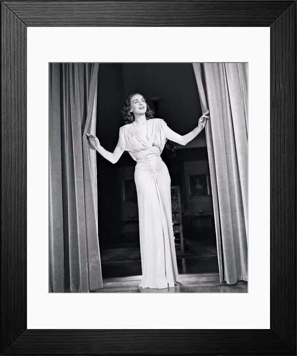 Framed Print : Women's fashion in the 1940s. A young woman in a typical 1940s outfit Framed Print : Women's fashion in the 1940s. A young woman in a typical 1940s outfit