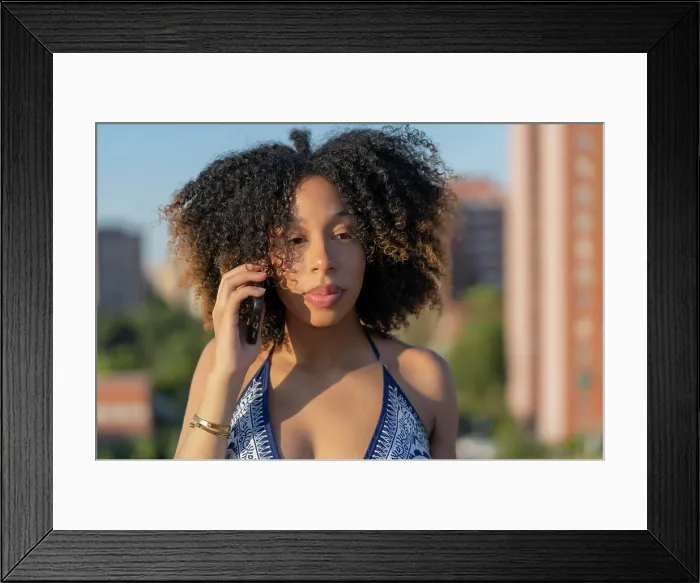 Framed Print : afro girl talking from her smartphone