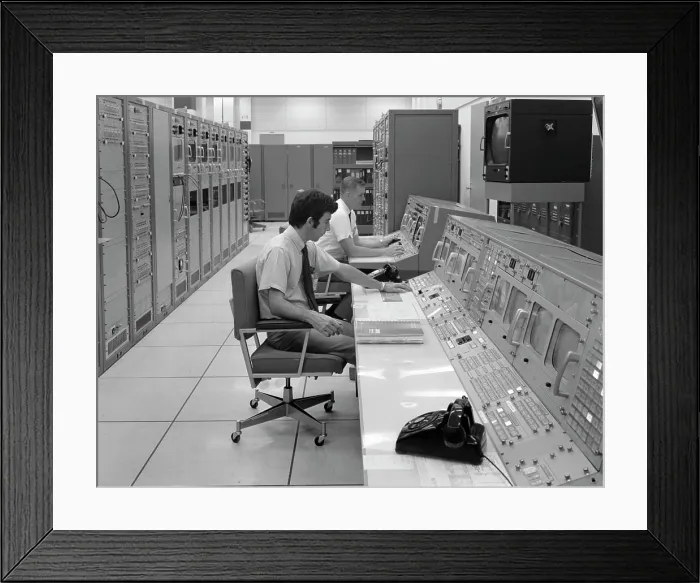 Framed Print : 1970S Two Men Sitting At Console Computer Room Mission Control Center Houston Texas Usa Framed Print : 1970S Two Men Sitting At Console Computer Room Mission Control Center Houston Texas Usa