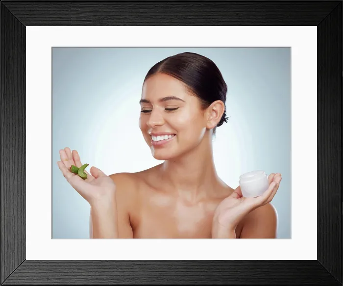 Framed Print : Face cream, aloe vera or woman with smile for beauty on white background with herbs Framed Print : Face cream, aloe vera or woman with smile for beauty on white background with herbs