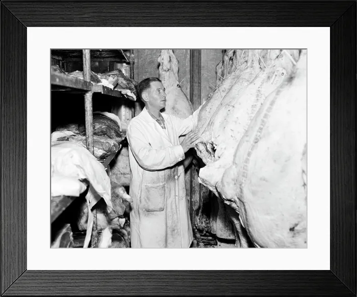 Framed Print : Butcher inspecting beef at butcher's shop Framed Print : Butcher inspecting beef at butcher's shop