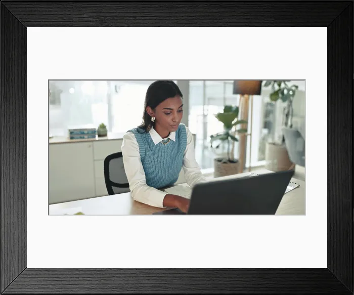 Framed Print : Accounting, finance and laptop with business Indian woman at desk in office for bookkeeping report Framed Print : Accounting, finance and laptop with business Indian woman at desk in office for bookkeeping report