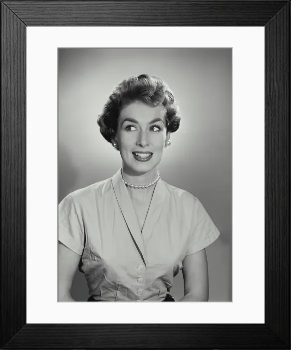 Framed Print : Vintage Photograph. Young woman cringes while she looks to the left of frame Framed Print : Vintage Photograph. Young woman cringes while she looks to the left of frame