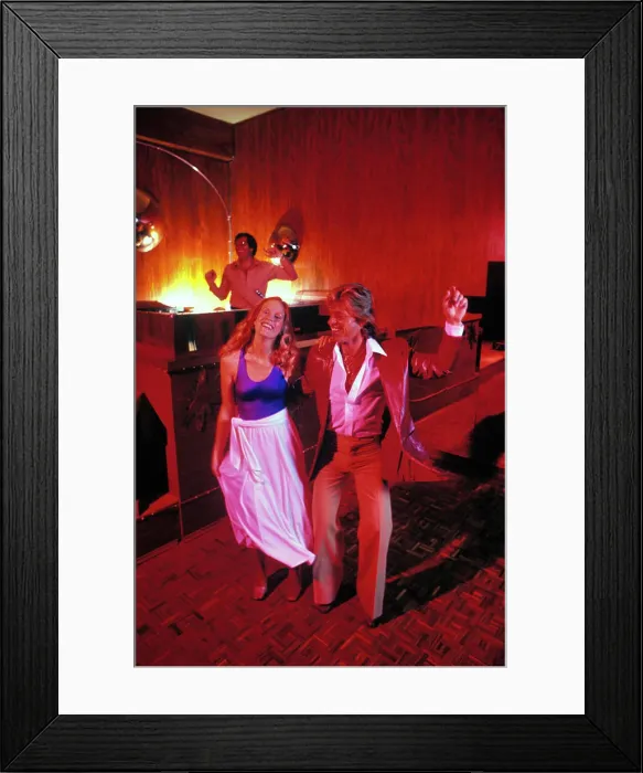 Framed Print : 1970s BLONDE COUPLE ON DISCO DANCE FLOOR DOING THE HUSTLE WOMAN WEARING SPANDEX TOP MAN IN LEATHER JACKET DJ IN Framed Print : 1970s BLONDE COUPLE ON DISCO DANCE FLOOR DOING THE HUSTLE WOMAN WEARING SPANDEX TOP MAN IN LEATHER JACKET DJ IN