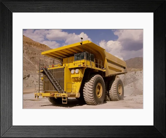 Framed Print : low angle dump truck earth mover yellow quarry mine