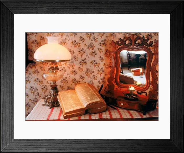Framed Print : Antique wooden bureau with Bible, lamplight and mirror reflecting candle and old bedroom interior in Sweden Framed Print : Antique wooden bureau with Bible, lamplight and mirror reflecting candle and old bedroom interior in Sweden