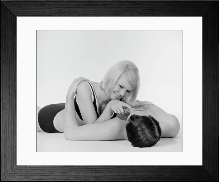Framed Print : Young semi-dress couple lying on floor Framed Print : Young semi-dress couple lying on floor