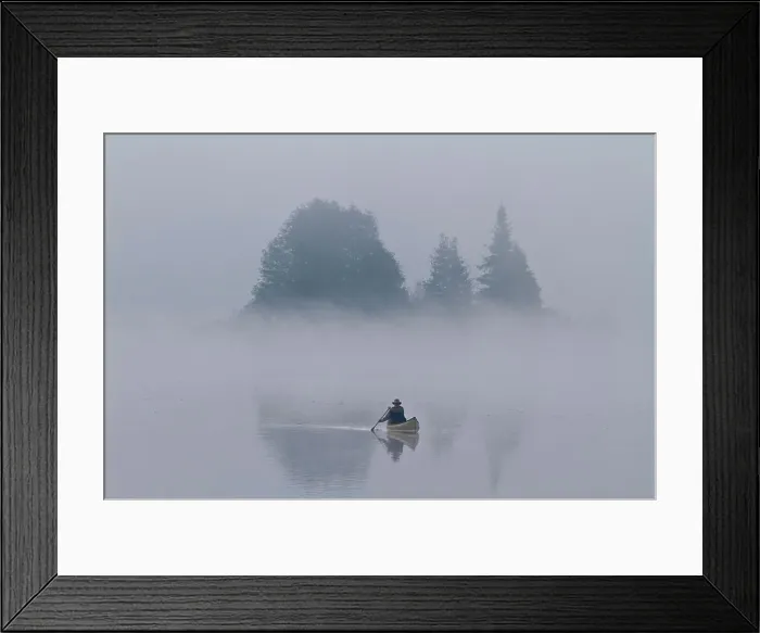 Framed Print : Man paddles solo canoe on Oxtongue Lake, Muskoka, Ontario Framed Print : Man paddles solo canoe on Oxtongue Lake, Muskoka, Ontario