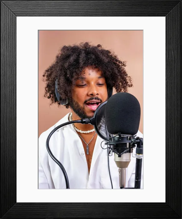 Framed Print : Young black man recording podcast or music